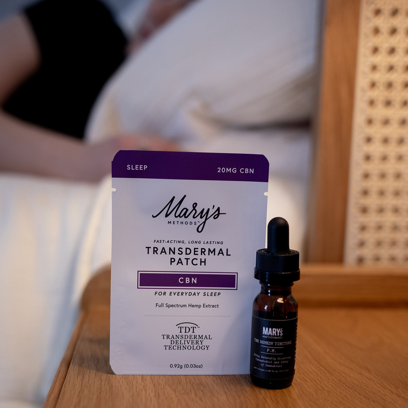 woman sleeping with Mary's CBN Patch and PM CBN:CBD Tincture