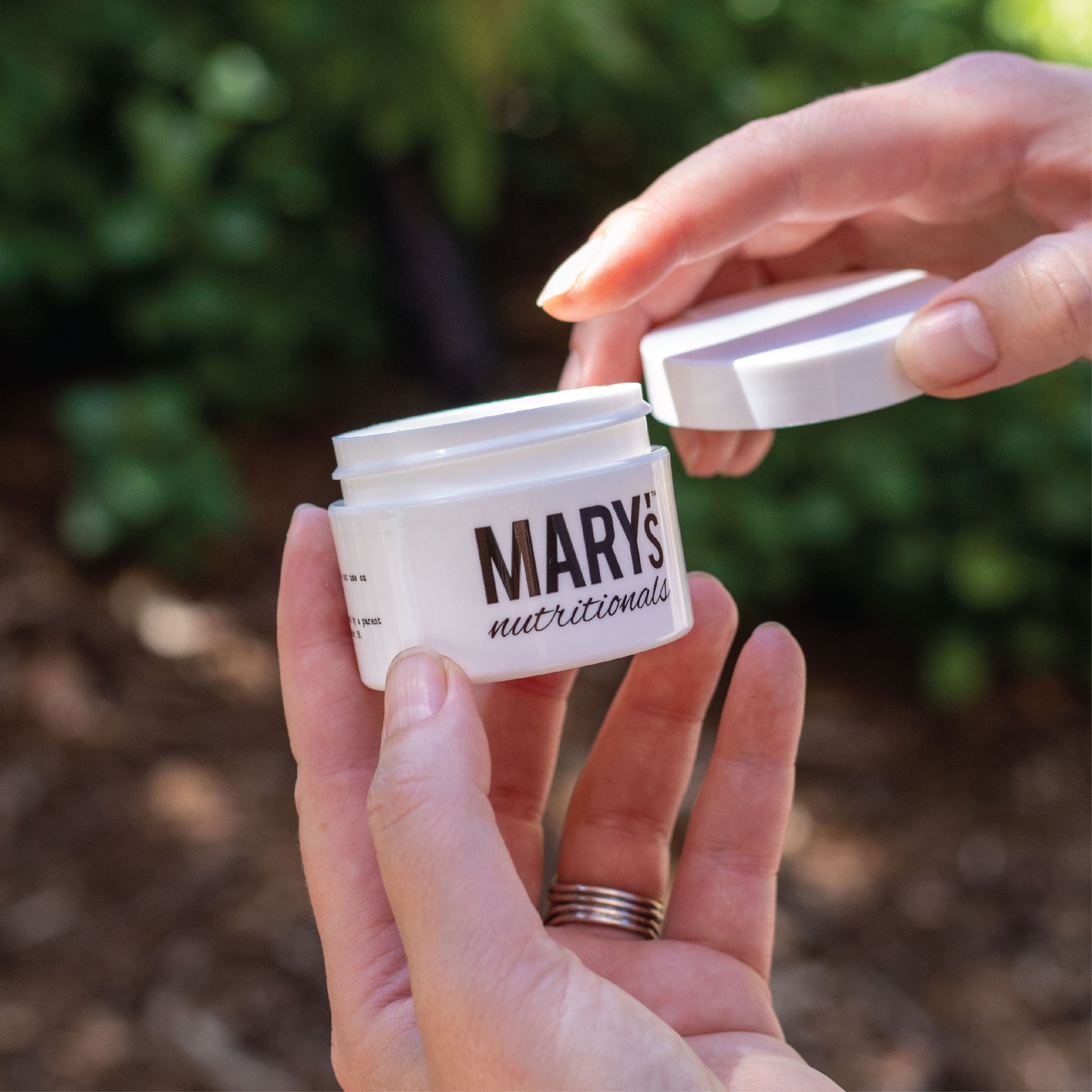 woman holding Mary's Nutrtionals compound in hand