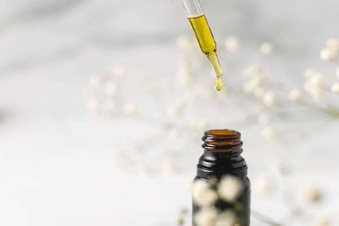 Tincture being dispensed into a bottle