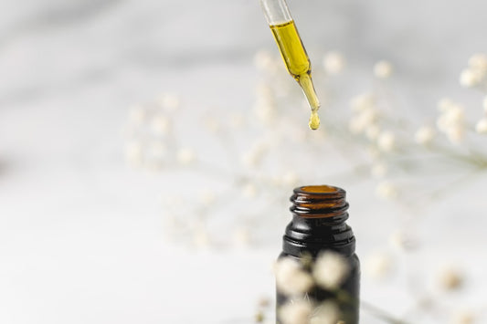 Tincture being dispensed into a bottle